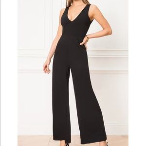 SUPERDOWN CARMELA DEEP V WIDE LEG BACKLESS JUMPSUIT IN BLACK